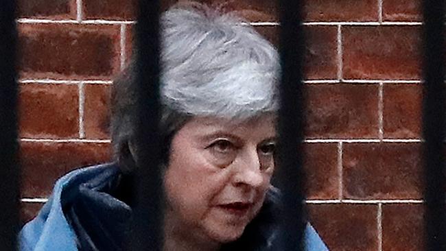 Britain's Prime Minister Theresa May leaves from the rear of 10 Downing Street in London on March 20, 2019. - Prime Minister Theresa May asked the EU to delay Brexit until June 30 as she scrambled to contain a deepening political crisis, but faced warnings that Britain could still crash out of the bloc in nine days. (Photo by Tolga AKMEN / AFP)