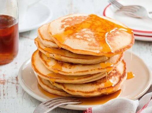 Make sure the pancakes are cooked evenly before flipping them in the pan â wait until lots of bubbles form on the surface and start to pop, then flip them.