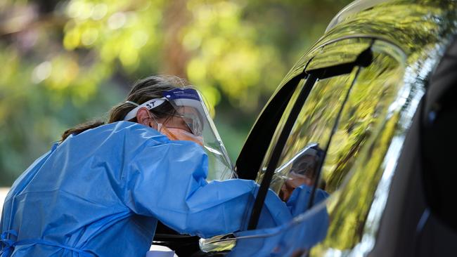 Nurses are seen working at the Covid-19 testing drive through clinic in Willoughby, Sydney. Picture: NCA NewsWire/ Gaye Gerard