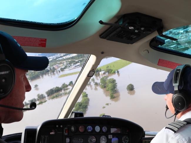 Ash Jenkinson and his crew flying over the Ballina Shire for food drop offs during the flood disaster earlier this year. Picture: Supplied