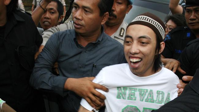 Cholili, Azahari's follower, escorted by police for the first trial at Denpasar District Court in Bali in 2006. Picture: Lukman/Bintoro