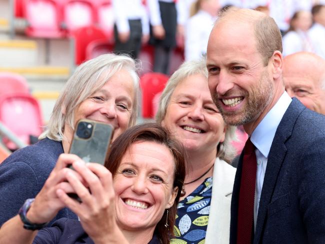 Prince William poses for selfies during his visit to Wales. Picture: Getty Images