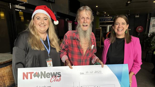 NT News and Sunday Territorian editor Melanie Plane and general manager Kirsten Porteous hand over a $74,500 cheque to bingo winner DJ Robertson.