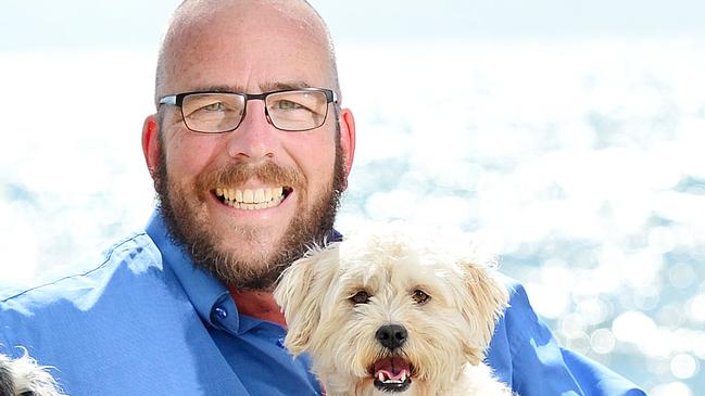 Pride of Australia: Veteran police dispatcher Rob Barton, played a key role in helping police arrest an alleged offender whilst walking his dogs at Frankston beach. Rob with his two dogs Jorja and Tilly.Picture : Nicki Connolly