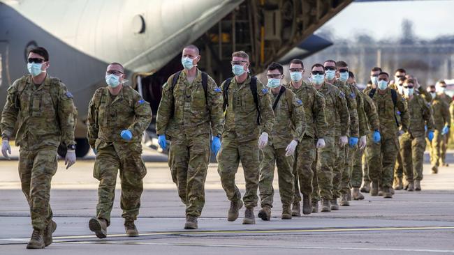 Up to 120 full-time ADF personnel from 1st Armoured Regiment, Adelaide, arrive in Melbourne on RAAF C-130 aircraft. Picture: Tim Carrafa