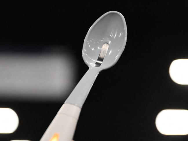 The Kirin Flavor-Enhancing Electronic Salt Spoon, which uses a weak electric current to concentrate sodium ion molecules food for increased Unami and salt flavor in low-sodium foods and encourage a lower salt diet, is displayed during CES Unveiled ahead of the Consumer Electronics Show (CES) in Las Vegas, Nevada on January 5, 2025. Gadgets, robots and vehicles imbued with artificial intelligence will once again vie for attention at the Consumer Electronics Show, as vendors behind the scenes will seek ways to deal with tariffs threatened by US President-elect Donald Trump. The annual Consumer Electronics Show (CES) opens formally in Las Vegas on January 7, 2025, but preceding days are packed with product announcements. (Photo by Patrick T. Fallon / AFP)