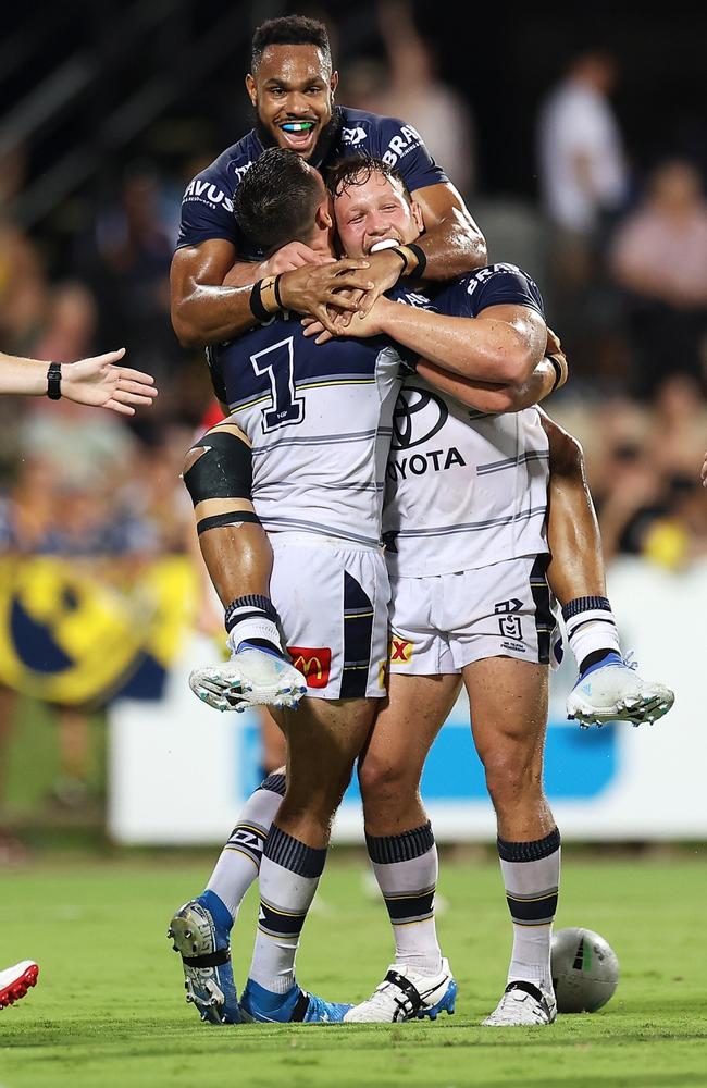 Hamiso Tabuai-Fidow celebrates with Scott Drinkwater and Reuben Cotter after scoring a try during round 8, 2022. (Photo by Mark Kolbe/Getty Images)