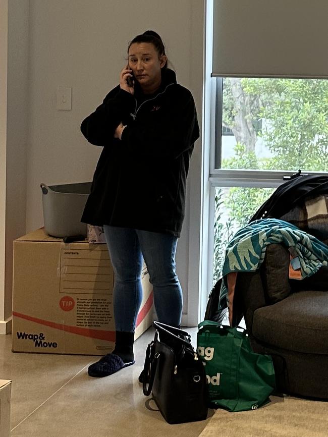 Kathryn Arnold on the phone during an inspection at her rental property.