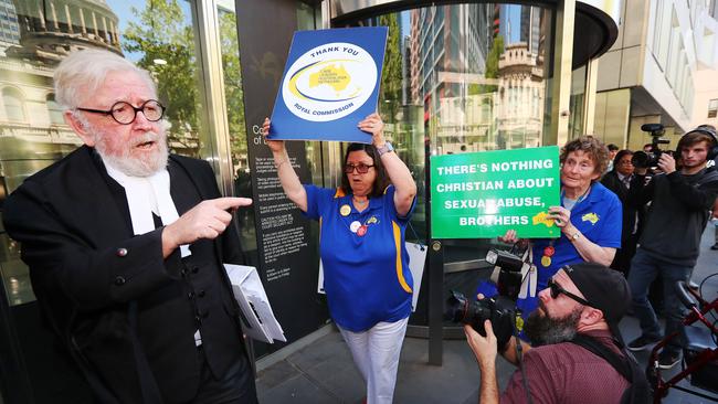 Robert Richter QC reacts to Pell critics outside Melbourne County Court on Wednesday.