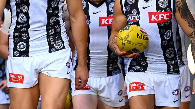 MELBOURNE, AUSTRALIA - MAY 21: The Magpies walk out onto the field during the round 10 AFL match between Carlton Blues and Collingwood Magpies at Melbourne Cricket Ground, on May 21, 2023, in Melbourne, Australia. (Photo by Quinn Rooney/Getty Images)