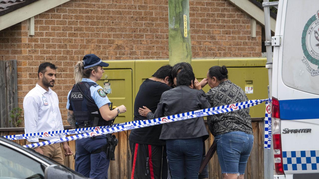 People were seen in tears at the shopping strip. Picture: NewsWire / Simon Bullard.