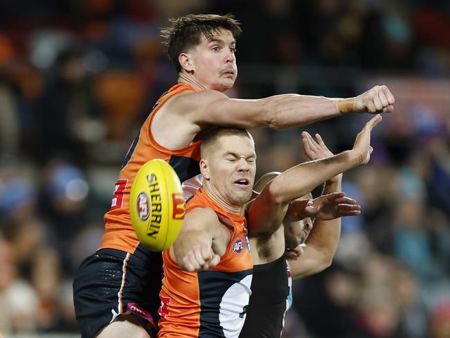 Sam Taylor flies over a pack to spoil.
