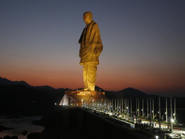 The Statue of Unity is seen at dusk at Kevadiya Colony in Narmada district of Gujarat State, India, Wednesday, Oct. 31, 2018. Indian Prime Minister Narendra Modi on Wednesday unveiled the towering bronze statue of Sardar Vallabhbhai Patel, a key independence leader being promoted as a national icon in the ruling party's campaign ahead of next year's general elections. (AP Photo/Ajit Solanki)