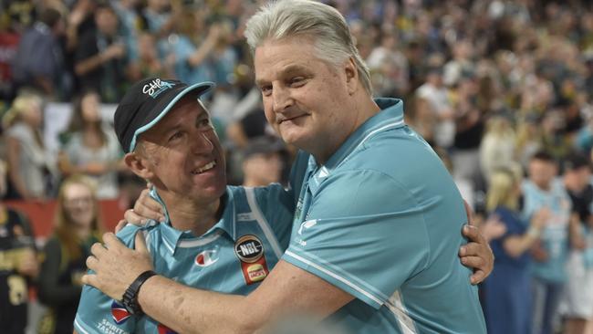 HOBART, AUSTRALIA - FEBRUARY 08: Scott Roth, Head Coach of the Jackjumpers embraces Scott Harris after the round 20 win in the NBL match between Tasmania Jackjumpers and Cairns Taipans at MyState Bank Arena, on February 08, 2025, in Hobart, Australia. (Photo by Simon Sturzaker/Getty Images)