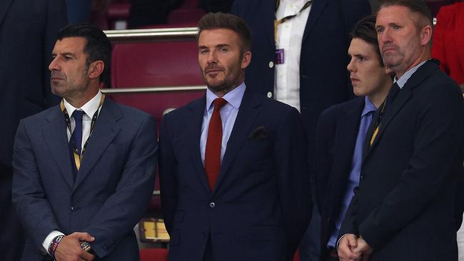 DOHA, QATAR - DECEMBER 17: Former players Luis Figo, David Beckham and Robbie Keane are seen with Cruz Beckham in the stands prior to the FIFA World Cup Qatar 2022 3rd Place match between Croatia and Morocco at Khalifa International Stadium on December 17, 2022 in Doha, Qatar. (Photo by Richard Heathcote/Getty Images)