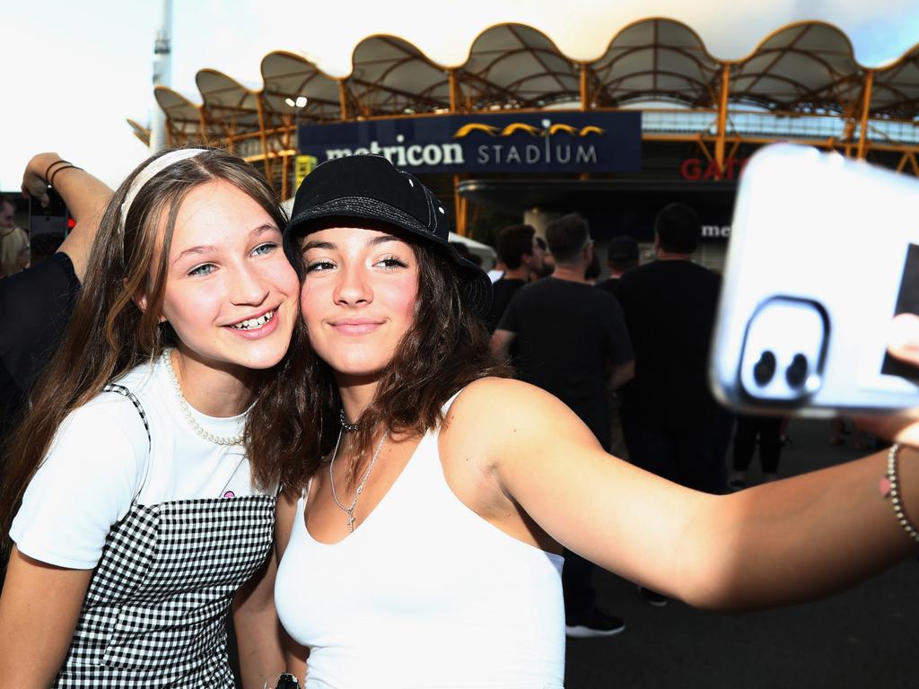 Hannah Lowry and Charlotte Flynn-Grant arrive at Metricon Stadium to see Queen Live. Photograph: Jason O'Brien