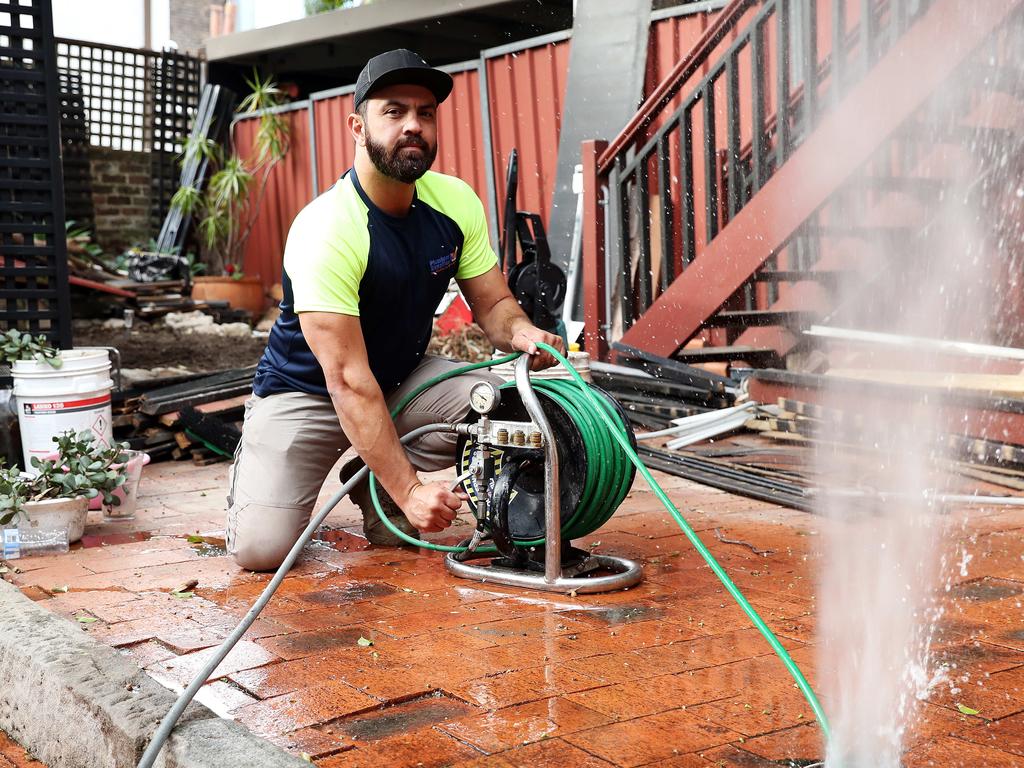 Plumber Alex Taskun is working more than 80 hours a week. Picture: Tim Hunter.