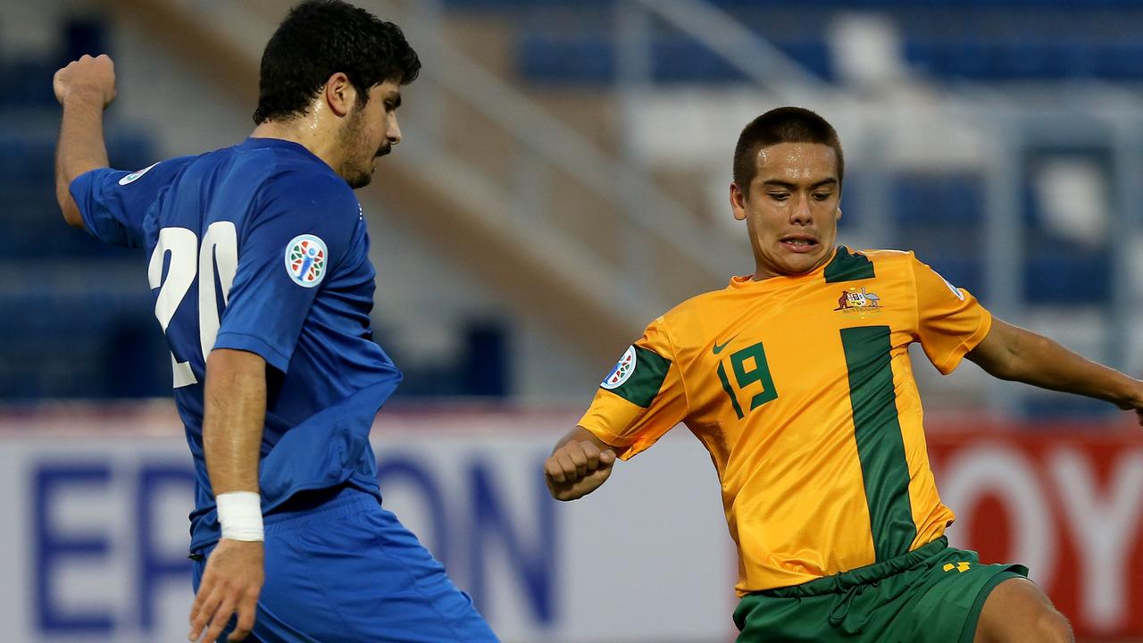 MUSCAT, OMAN - JANUARY 12: Christopher Gligor of Australia compete for the ball with Khaled Ebrahim during the AFC U-22 Championship Group C match between Australia and Kuwait at Royal Oman Police Stadium on January 12, 2014 in Muscat, Oman. (Photo by Francois Nel/Getty Images)