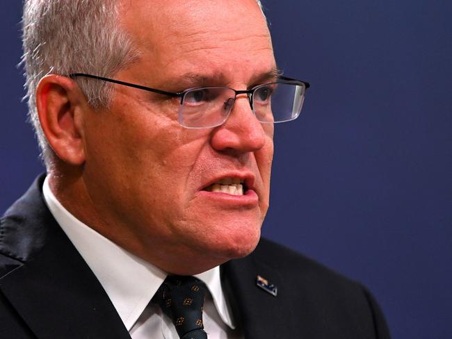 Australia's Prime Minister Scott Morrison speaks to the media to announce sanctions on top Russian officials following the invasion of eastern Ukraine, during a press conference in Sydney on February 23, 2022. (Photo by Steven SAPHORE / AFP)