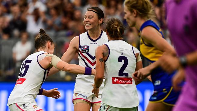 Roxanne Roux of the Dockers celebrates a goal in the derby.