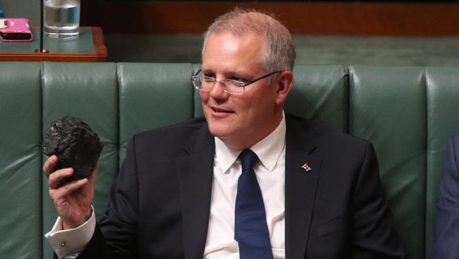 Scott Morrison with a lump of coal in parliament