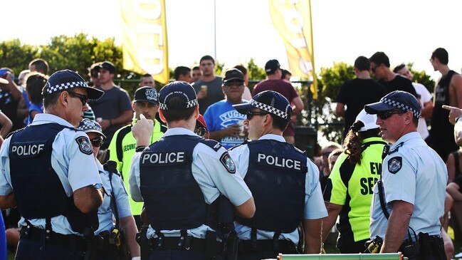 A large crowd gathered at Pizzey Park, Miami, for the Bycroft Cup rugby league grand final match between the Tugun Seahawks and the Southport Tigers. Police rush to break up a fight in the crowd.