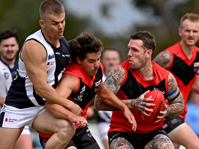 Dane Swan gets a shepherd in heavy traffic. Picture: Andy Brownbill