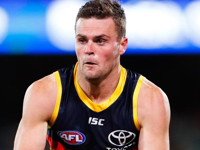 ADELAIDE, AUSTRALIA - JULY 20: Brad Crouch of the Crows runs with the ball during the round 7 AFL match between the Adelaide Crows and the St Kilda Saints at Adelaide Oval on July 20, 2020 in Adelaide, Australia. (Photo by Daniel Kalisz/Getty Images)