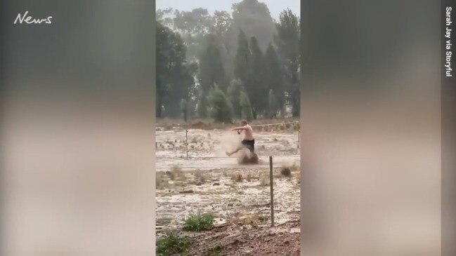 Aussie bloke Celebrates rain in drought-stricken Dubbo