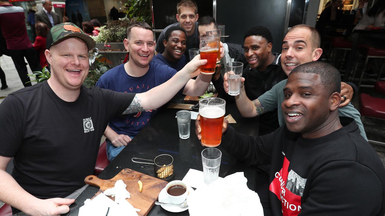 Sailors Alex H from Florida, Bob Jenkins from Seattle, Drew Creek from New York and Martin Lawrence from Detroit from the USS Ronald Reagan military at the Pig ‘N’ Whistle in the Queens St Mall. Picture: Annette Dew