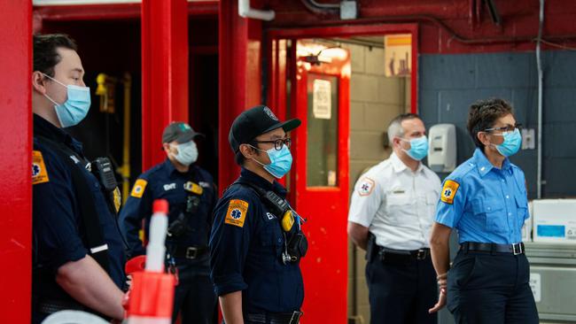 New York firefighters wait for donated meals to firefighters on International Firefighters Day. Picture: AFP.