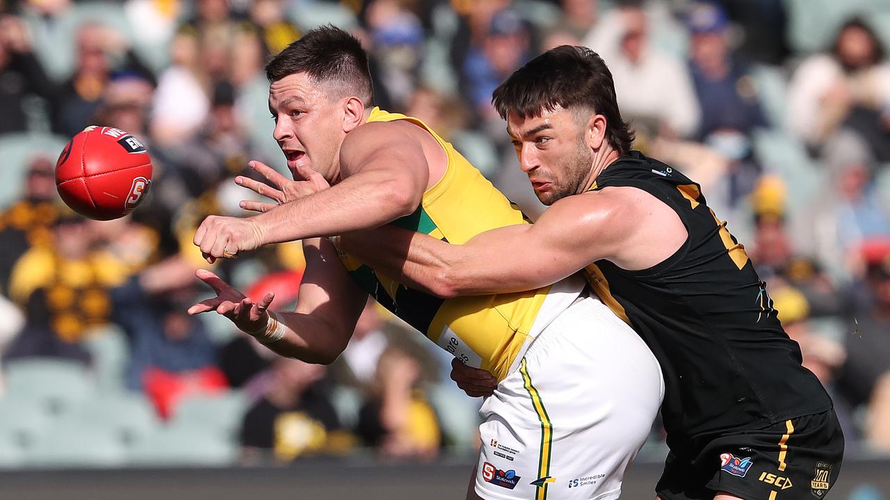 Jesse Lonergan of the Eagles and Brett Turner of Glenelg. Picture: Sarah Reed