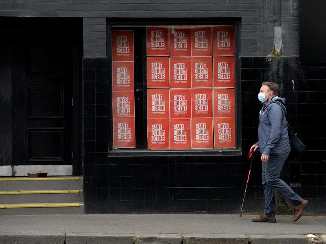 A lone pedestrian walks past live music venue the Corner Hotel in Richmond. It is hoped stage 4 restrictions may be eased in Melbourne from next week, allowing pubs and live music venues to start operating again. Picture: NCA NewsWire/Andrew Henshaw