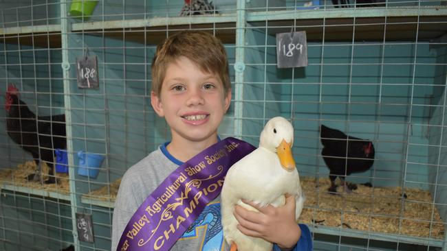 Eight-year-old Charlie Turner from Walkerston State School with his prize-winning duck from last year’s show. Picture: Lillian Watkins