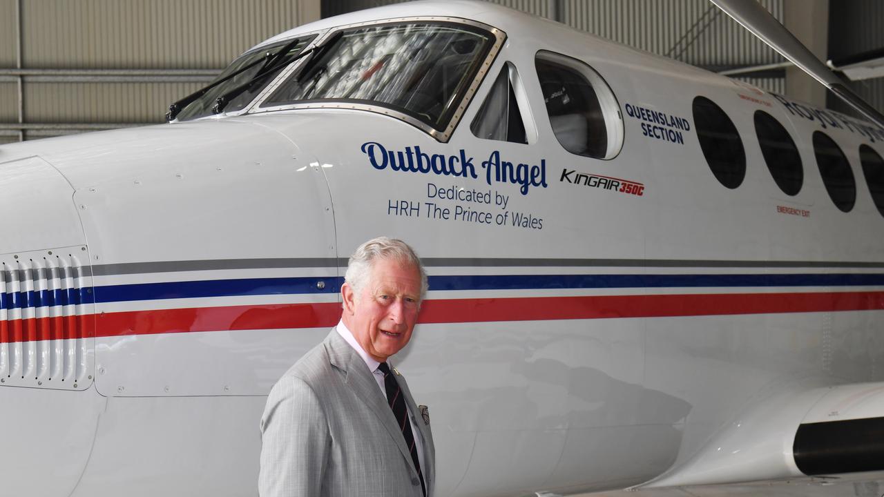 Prince Charles unveils the newest addition to the fleet during a visit to the Royal Flying Doctor Service base.