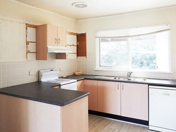 The old kitchen was basic and outdated.