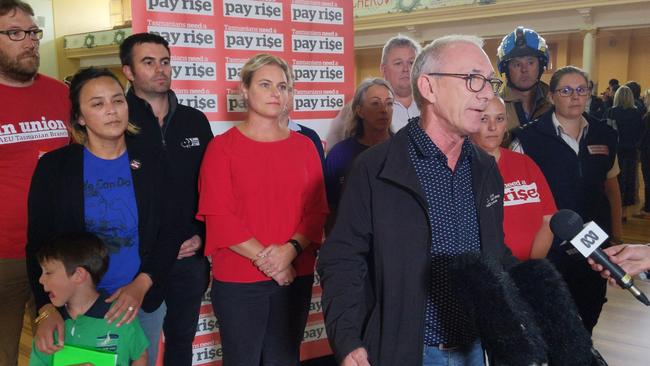 HACSU's Tim Jacobson flanked by other union representatives ahead of the public service stop-work rally at Hobart's City Hall. Picture: DAVID KILLICK