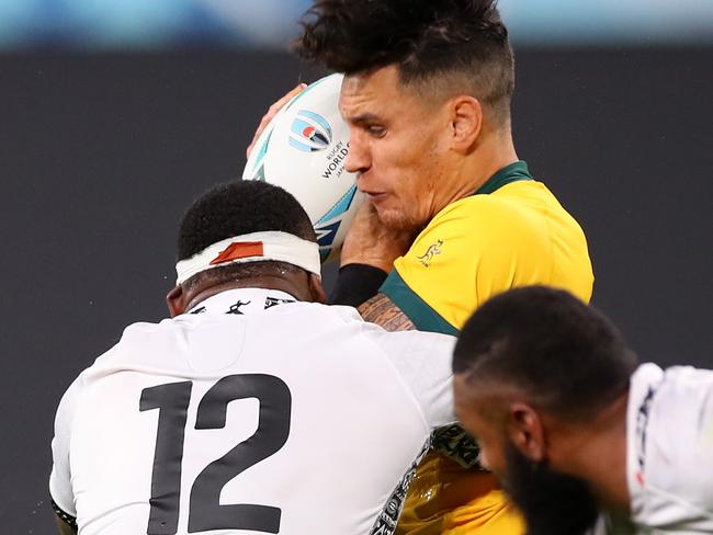 Fiji’s Levani Botia crunches Australia’s Matt Toomua. Picture: Getty Images