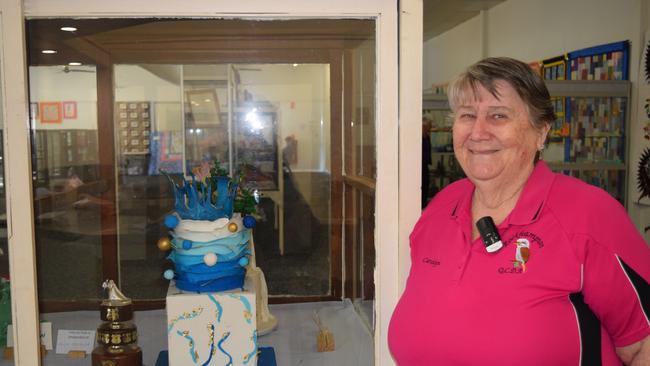 Carolyn Roberts, a member of the Rockhampton Branch of Cake Decorators, with her winning wedding cake.