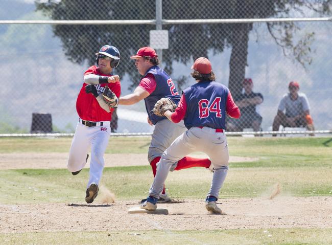 GOT YOU: Taewoo Kim of Indians is tagged out by Toowoomba Rangers' pitcher Lawrence Taylor during Sunday's GBL Division 4 round 11 game at Commonwealth Oval.