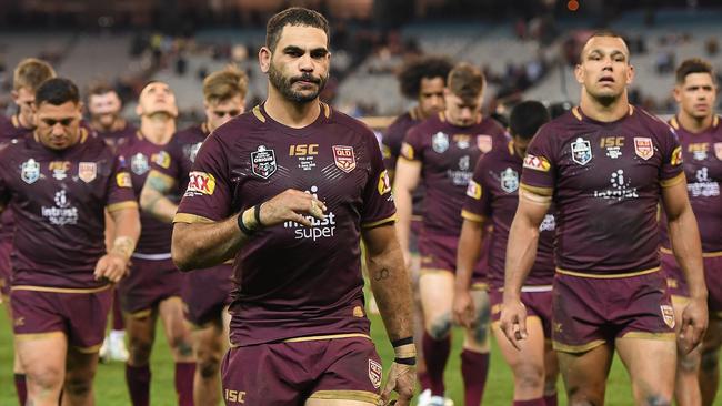 Greg Inglis leads the Maroons from the ground after Game 1 of the 2018 State of Origin series at the MCG. Picture: AAP/Julian Smith