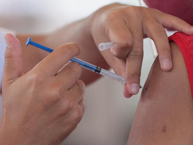 ACAPULCO, MEXICO - MARCH 19: A health worker applies a dose of CoronaVac vaccine on March 19, 2021 in Acapulco, Mexico. Acapulco began its vaccination plan for senior citizens on March 17, people over 60 years old will receive the first dose of the vaccine against Covid-19. Acapulco remains as one of the favourite tourist destination for Mexicans. (Photo by Hector Vivas/Getty Images)