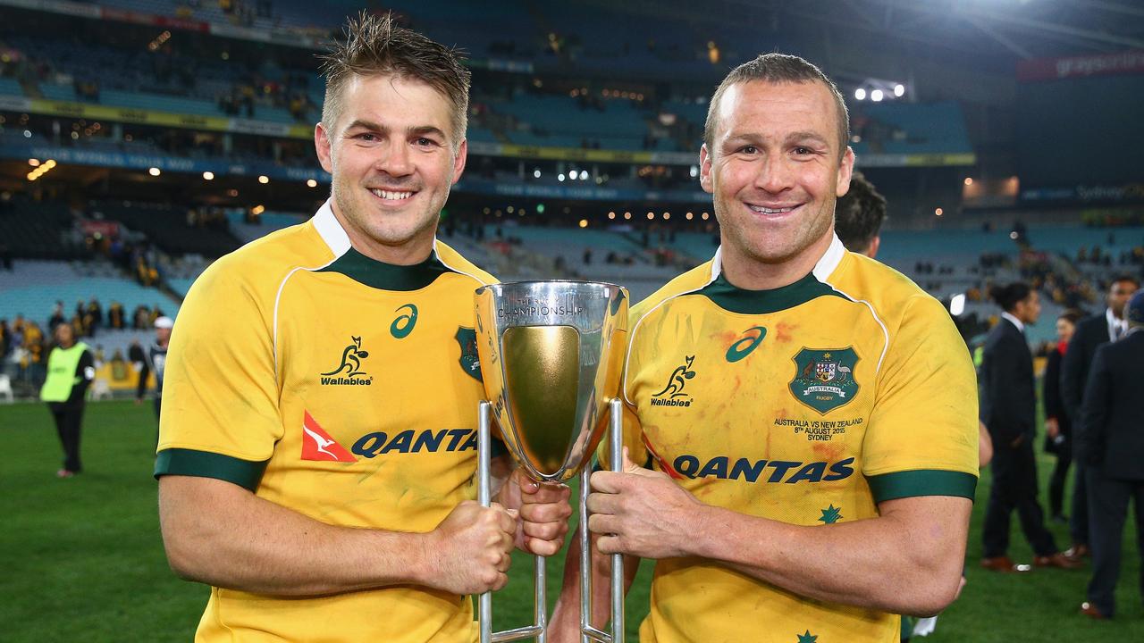 Drew Mitchell and Matt Giteau of the Wallabies pose with the Rugby Championship.
