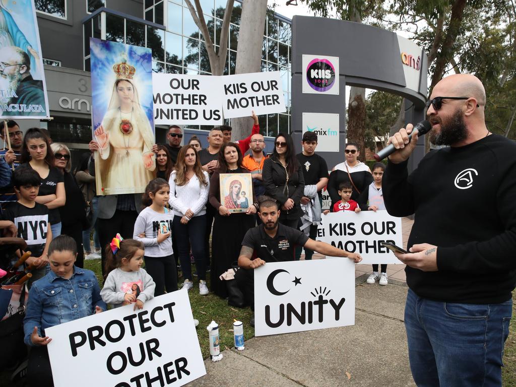 Protestors have begun to gather outside Kiis FM headquarters in North Ryde to protest against comments Kyle Sandilands made about Christians and the Virgin Mary. Protest leader Georgie Mark speaks to the protestors. Picture: David Swift.