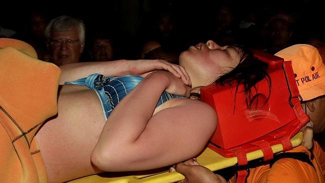 Survivor... n Indonesian rescue team evacuates a Japanese tourist after she was found alive and clinging to a reef off Bali, after three days at sea. Picture: Getty