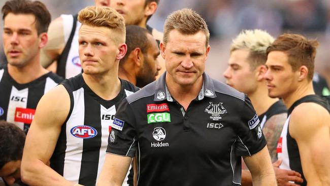 Nathan Buckley leaves the quarter-time huddle against Essendon at the MCG with a worried look on his face. The 37-point Round 16 loss killed off Collingwood’s finals hopes. Picture: Getty Images
