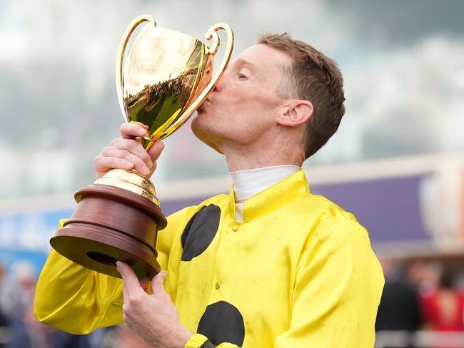 Mark Zahra poses with the Caulfield Cup after winning the Carlton Draught Caulfield Cup at Caulfield Racecourse on October 21, 2023 in Caulfield, Australia. (Photo by Scott Barbour/Racing Photos via Getty Images)