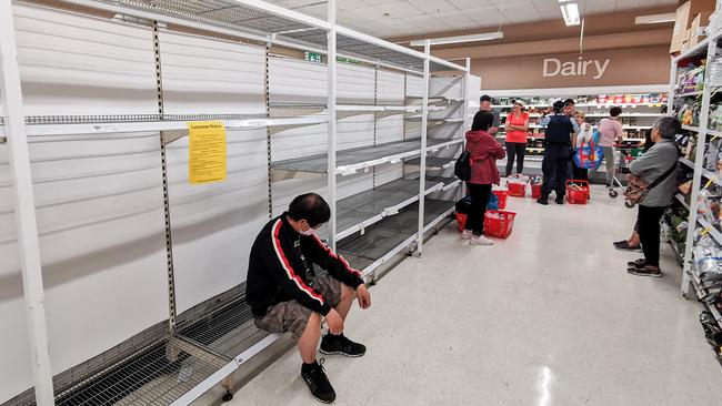 People wait for a delivery of toilet paper at Coles Epping, Sydney, March 20. Picture: AAP Image/James Gourley