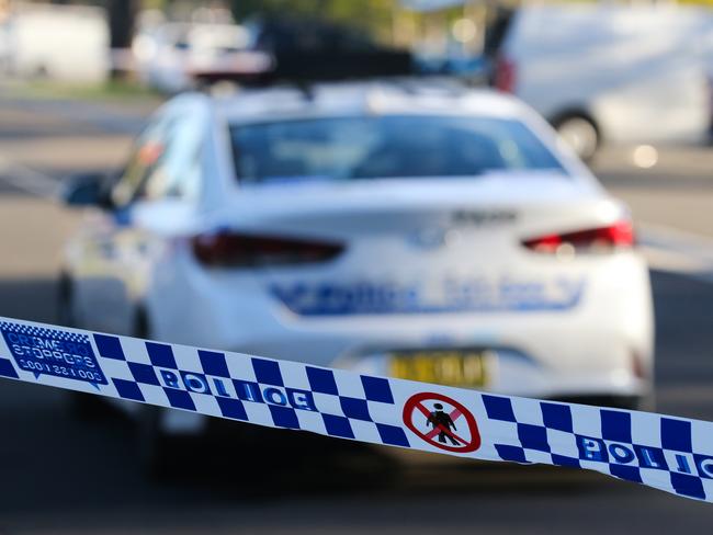 SYDNEY, AUSTRALIA - NEWSWIRE PHOTOS June 14 2022: A general stock image of a Police tape in front of a Police car in Sydney. Picture NCA Newswire/ Gaye Gerard.