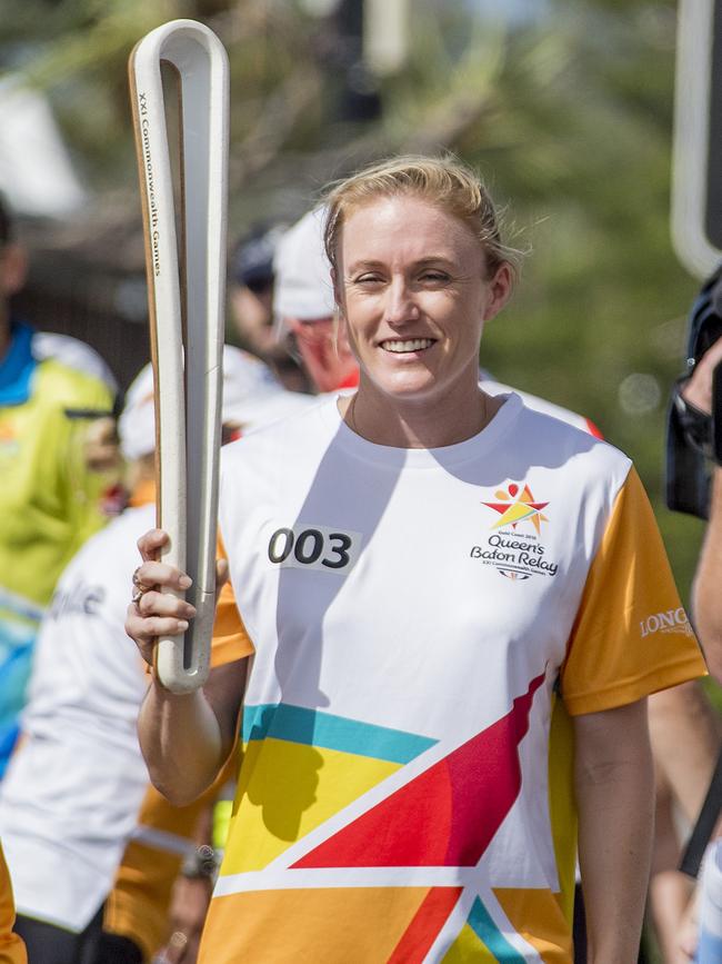 Sally Pearson walks her leg of the Queen’s Baton Relay in Surfers Paradise yesterday. Photo: Jerad Williams